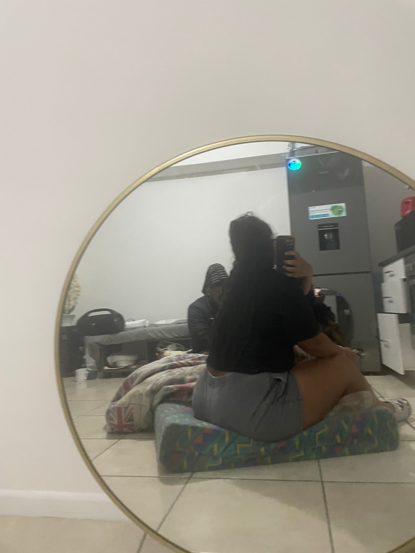 TJ taking a mirror selfie in the early days